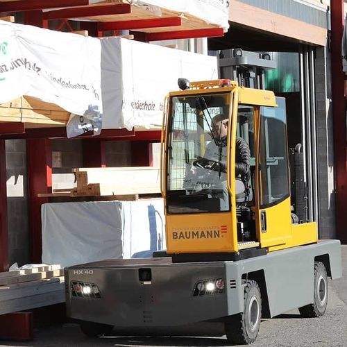 Дизельная подъемная тележка - HX series - Baumann Srl - с местом для сидения водителя / 4-колесная / боковая