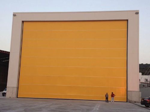 Раздвижной ворота для ангара - PUERTA HANGAR DE LONA - DOOR KING DE MEXICO, S.A. DE C.V. - для самолета / автоматический